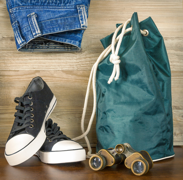 Shoes, backpack, jeans and  binoculars - Photo, Image