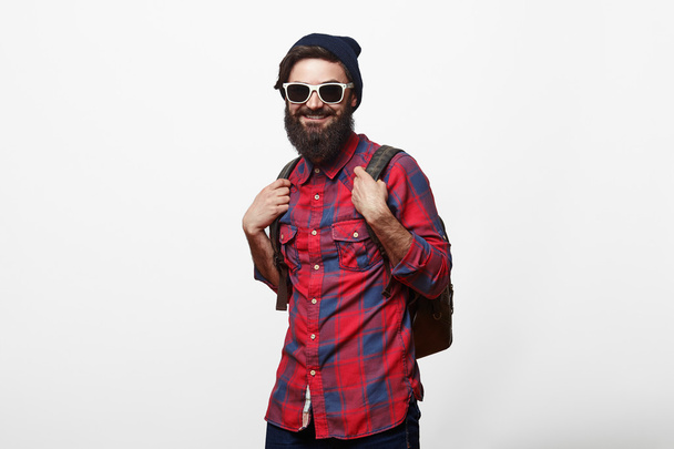 happy young bearded man in eyeglasses with backpack - Fotó, kép