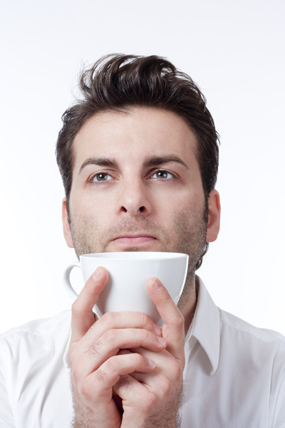 Man holding cup of coffee - Фото, зображення