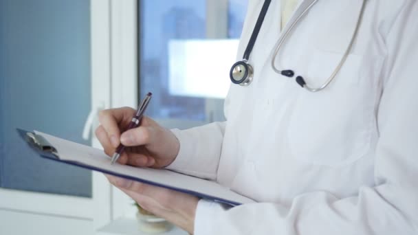 Doctor Writing Medical Record - Footage, Video