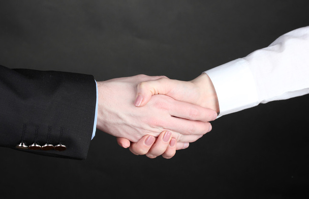 Business handshake on gray background - Fotografie, Obrázek