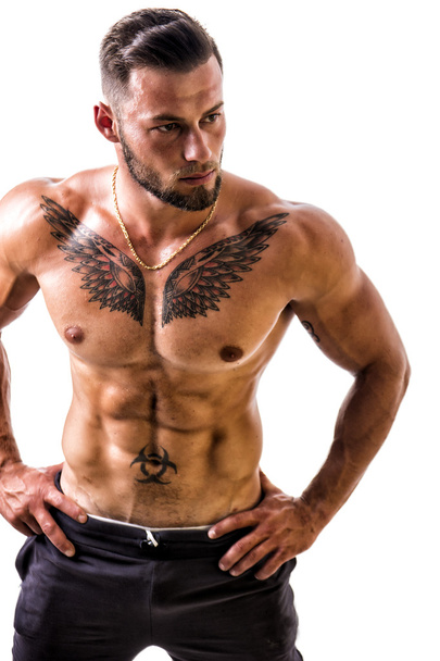 Handsome topless muscular man standing, isolated - Foto, afbeelding