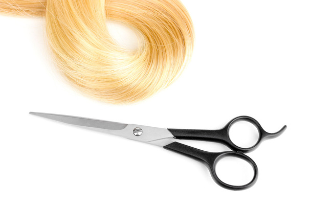 Shiny blond hair and hair cutting shears isolated on white - Photo, Image