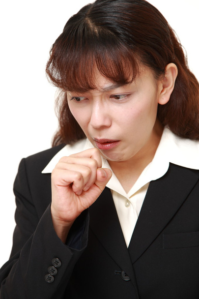 Asian businesswoman coughing - 写真・画像