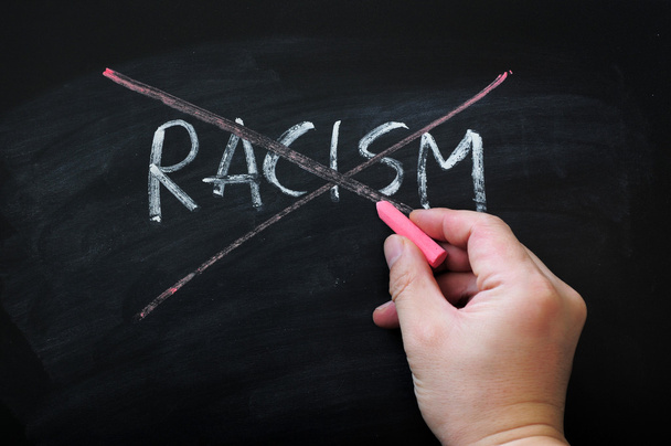 Cross out racism on a smudged blackboard background - Fotoğraf, Görsel