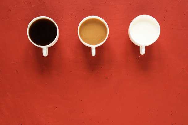 Three cups with milk and coffee - Φωτογραφία, εικόνα