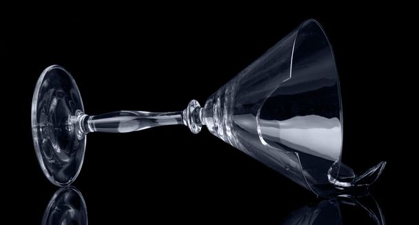 Broken glass tumbler cocktail isolated on  black background. - Foto, Bild