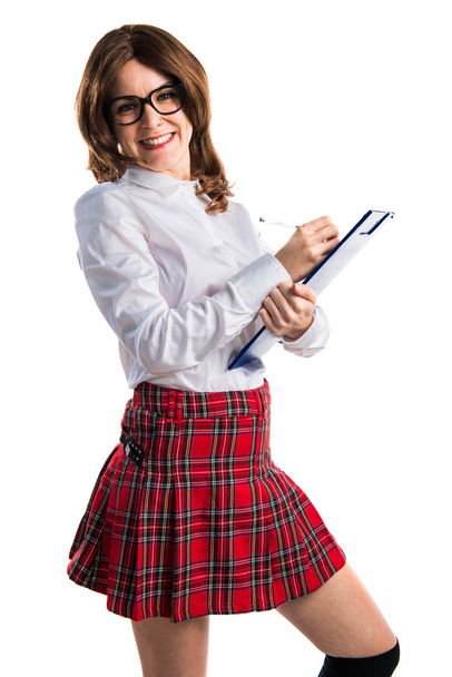 Student dziewczynka gospodarstwa szkolnego notatki - Zdjęcie, obraz