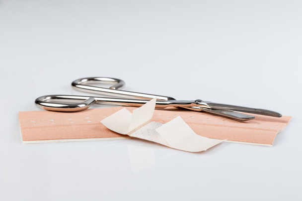 Plaster bandage roll and scissors - Photo, Image