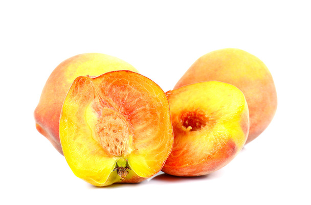 Peach full ball and cut  half on white background. - Фото, зображення