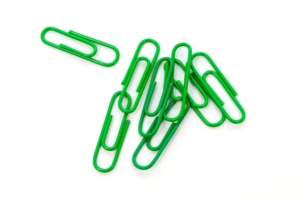 Green paper clip on white background - Photo, Image