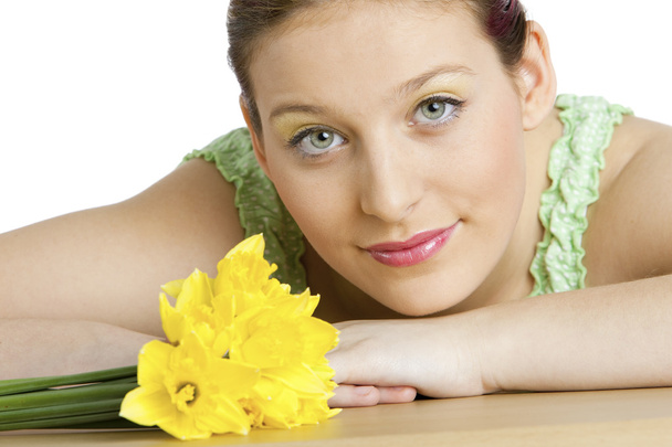 Portrait of youg woman with daffodils - Photo, Image