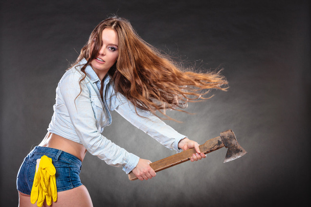 Sexy strong woman feminist with axe working. - Fotoğraf, Görsel