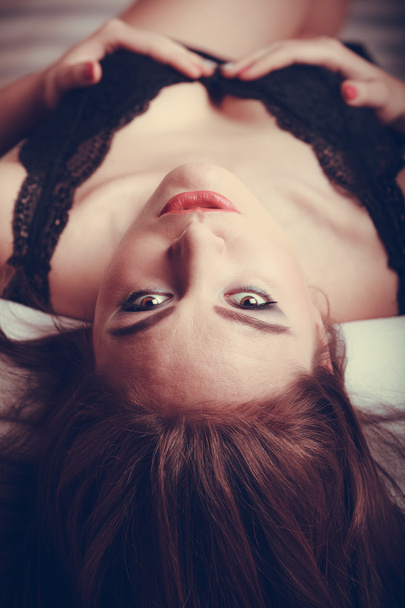 Seductive young woman in lingerie in bed. - Fotó, kép