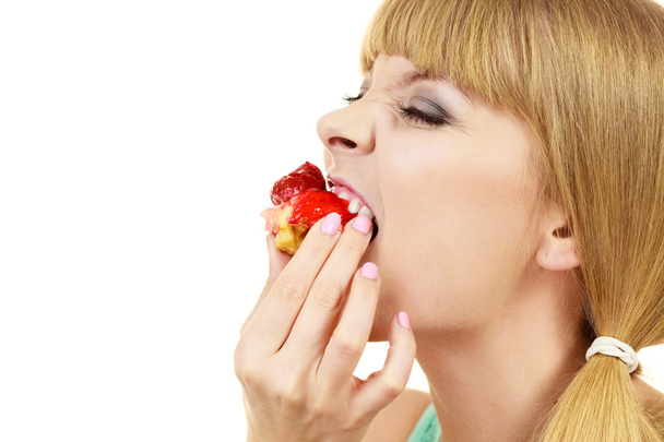 Woman eating cupcake sweet food  - Фото, зображення