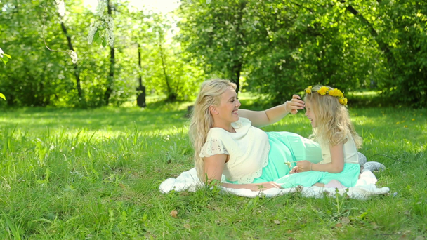 Young pregnant mother plays with her daughter. Happy family. - Footage, Video