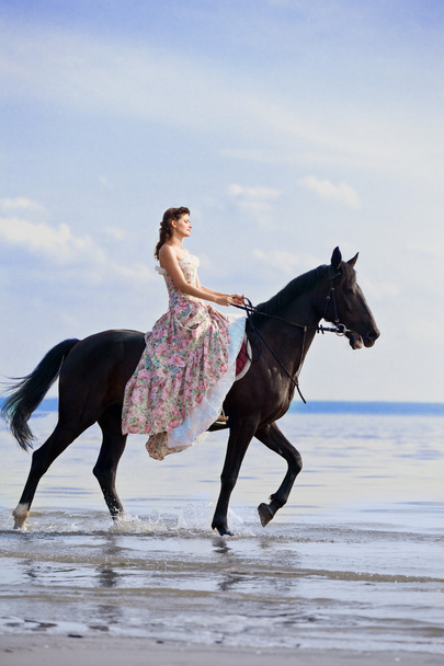 Woman on a horse by the sea - Fotografie, Obrázek