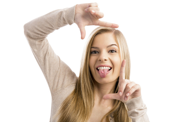  Beautiful teenager girl making a silly face - Photo, image