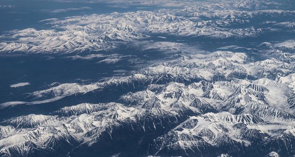 Snow-capped mountains. - Фото, изображение