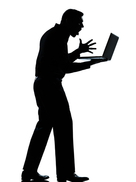 One business man silhouette computing computer laptop angry disp - Fotó, kép