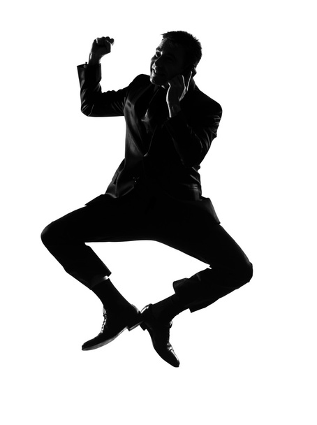 Silhouette man winner on the phone jumping - Foto, immagini