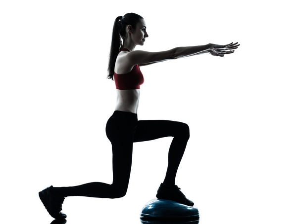 Woman exercising bosu balance ball trainer - Фото, зображення