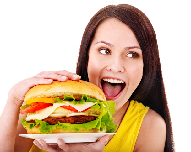 Femme tenant hamburger
. - Photo, image
