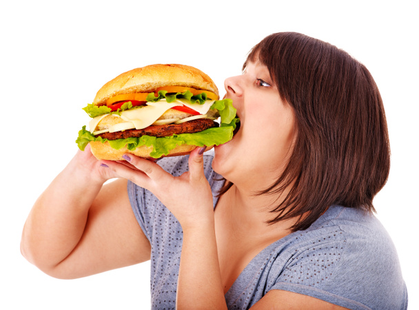 Woman eating hamburger. - Valokuva, kuva