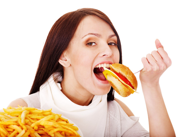 Frau isst Fast Food. - Foto, Bild