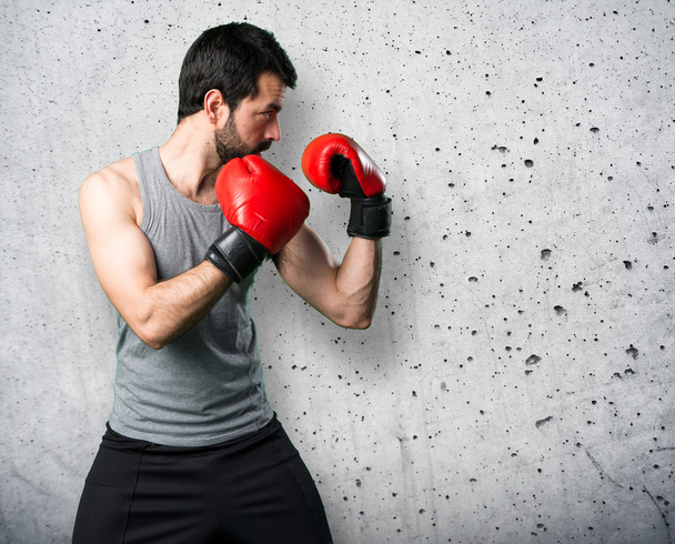 Sportman with boxing gloves - Фото, зображення