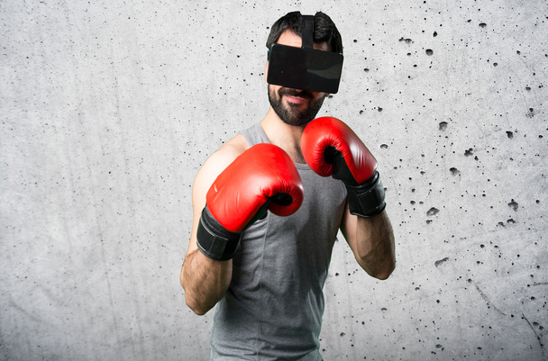 Sportman with boxing gloves and VR glasses - Photo, Image