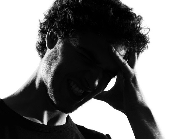 Young man silhouette headache sadness - Фото, изображение