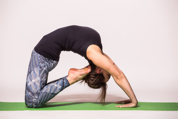 Young woman practicing yoga - Foto, Imagen