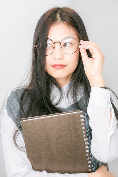 Nerd beautiful young asian school girl hold lecture book - Photo, Image