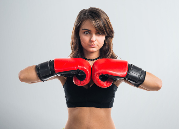 Young girl with boxing gloves - Foto, Imagen