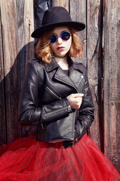 stylish girl in black leather jacket and long skirt - Фото, зображення