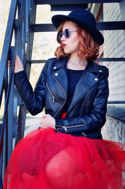 stylish girl in black leather jacket and long skirt - Fotó, kép