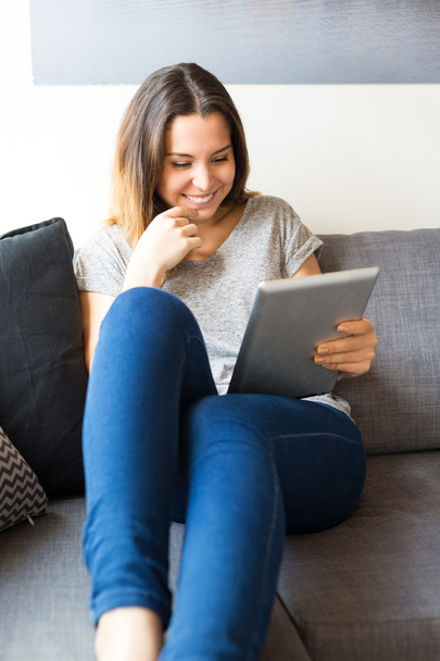 Woman relaxing with digital tablet - Photo, Image