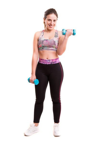 mujer joven haciendo ejercicio con pesas  - Foto, imagen