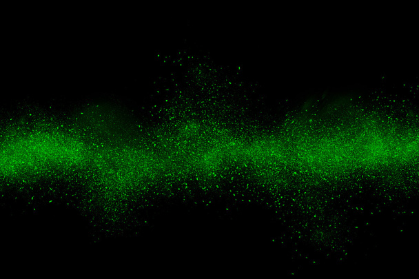 Explosão de pó abstrato verde em um fundo preto
 - Foto, Imagem