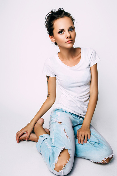 Studio photo of young  woman on white background - Valokuva, kuva