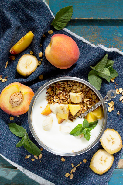 Healthy breakfast of muesli, berries with yogurt and seeds on a  - Фото, зображення