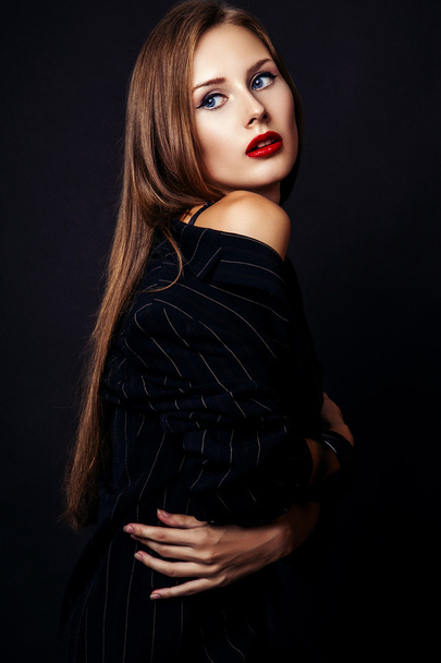 Studio photo of young  woman on black background - Zdjęcie, obraz