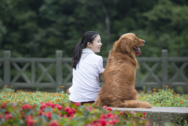 Lovely girl and her dog - Фото, зображення