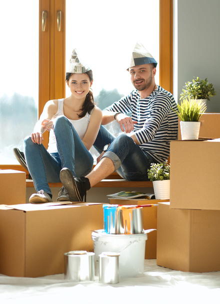 Portrait of young couple moving in new home - Photo, Image