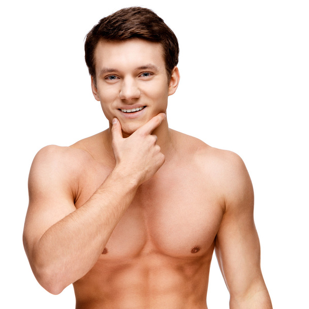 Handsome young man sniffing his armpit - Фото, зображення