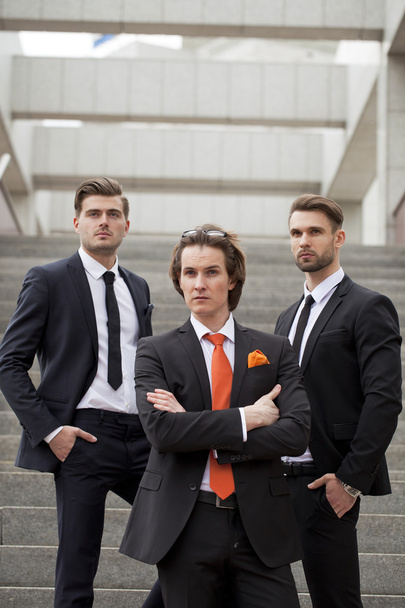 Three young men in elegant business suits - Fotoğraf, Görsel