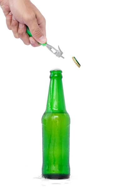 Hands are opening a beer bottle. - Photo, Image