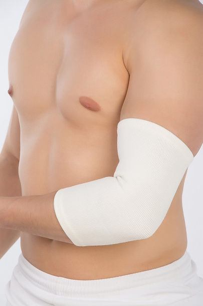 elastic bandage on elbow - Foto, afbeelding