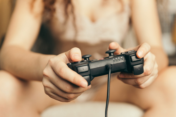 Girl out of focus holding a joystick - Photo, image